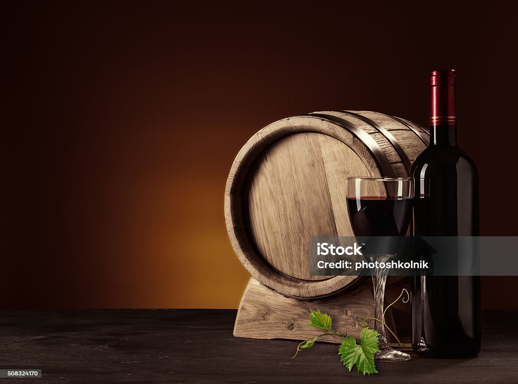 bottle, glass and oak barrel still life with bottle, glass and oak barrel Alcohol - Drink Stock Photo