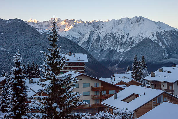 Ski resort with wooden chalets in winter