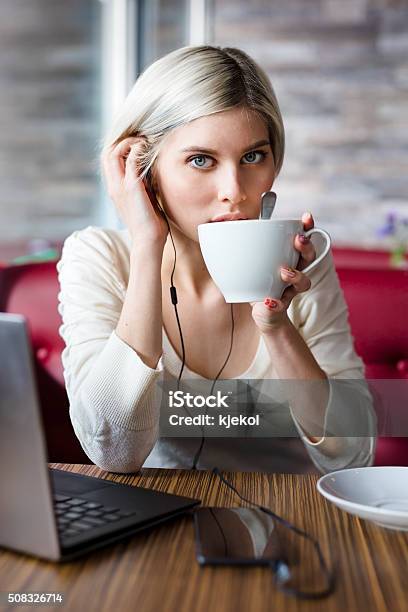 Woman Working With Laptop Computer In Cafe Stock Photo - Download Image Now - Adult, Adults Only, Beautiful People