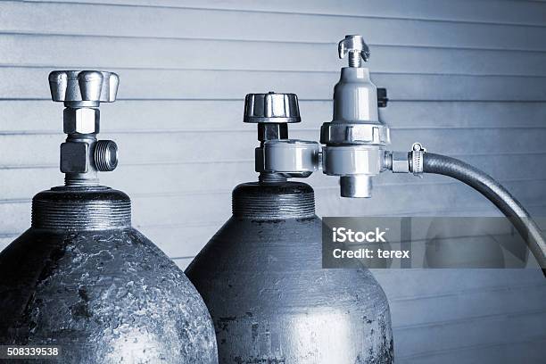 Two Oxygen Cylinders Stock Photo - Download Image Now - Natural Gas, Oxygen Tank - Breathing Device, Cylinder