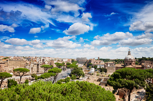 Cityscape of the Colosseum (Flavian Amphitheatre) and Roman forum in Rome, Italy. It was constructed in the 1st century AD.