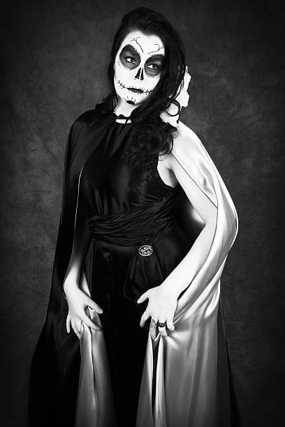 istock Woman in SugarSkull makeup, B&W, three quarter length. 508346334