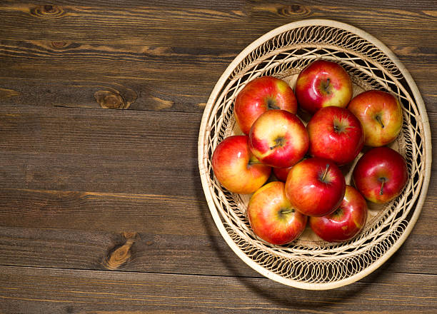 istock fresh apples on a wooden table in the background 508346464