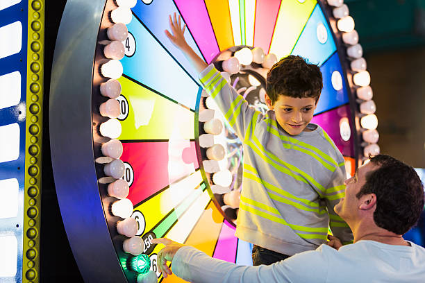 istock Father and son at an amusement arcade 508347299