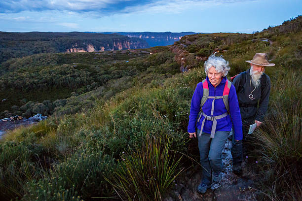 istock Senior Couple Bushwalking at Dawn in a Spectacular Landscape 508347318