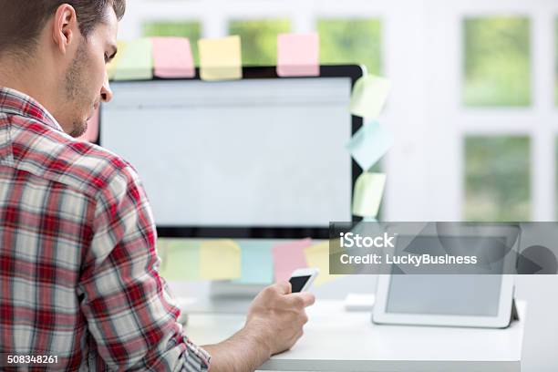 Man Front Of Monitor With Notes On It Stock Photo - Download Image Now - Adhesive Note, Adult, Business