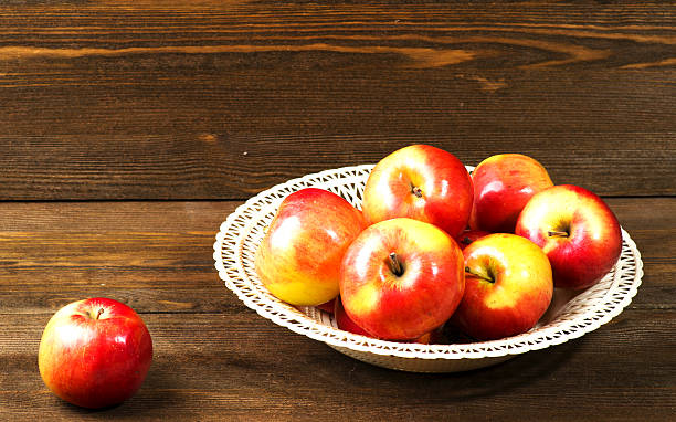 istock fresh apples on a wooden table in the background 508349762