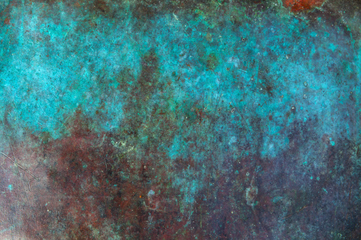 Image of antique copper vessel surface texture.