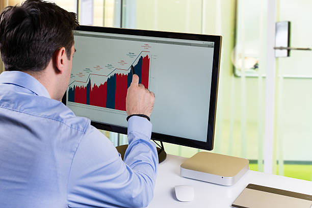 Businessman analysing charts stock photo