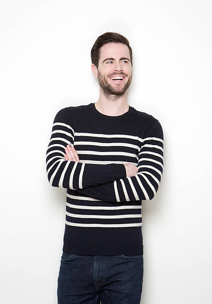 istock Young man laughing with arms crossed 508353987