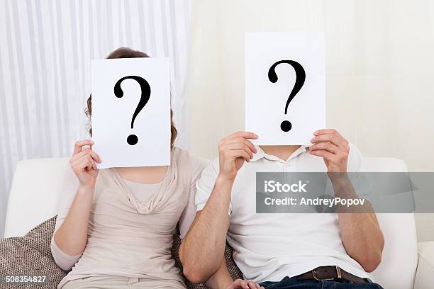 Couple With Question Marks Stock Photo - Download Image Now - Adult, Asking, Choice