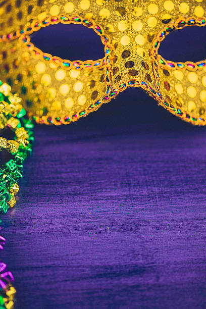 istock Mardi Gras background with novelty bead necklaces and masquerade mask 508371848