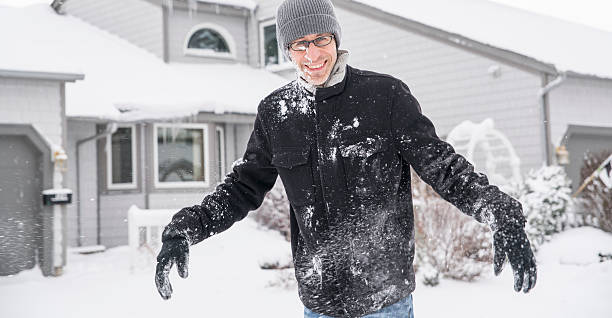 istock Mature man have fun outdoor under the snowfall 508372106