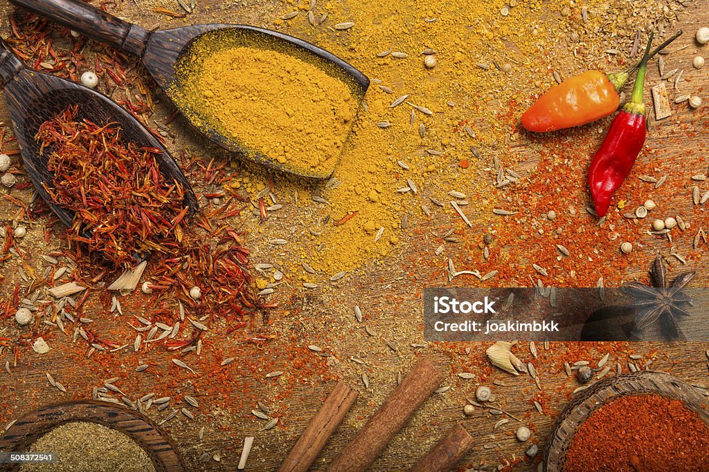 Spices background Variety of spices on a wooden table. Chili Con Carne Stock Photo