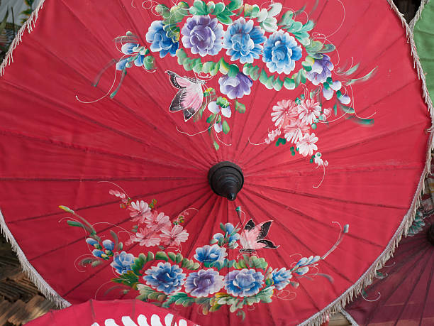 istock Red rice paper umbrella dried in nature. 508374289