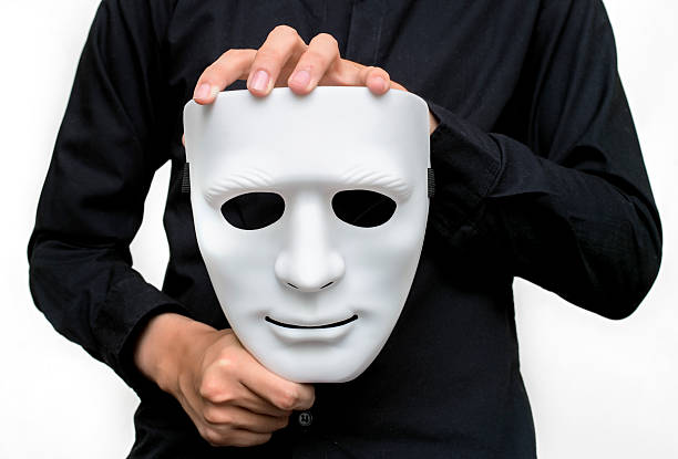 istock Man wearing black shirt holding a white mask 508374956
