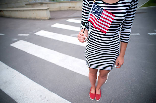 istock woman hand holding american flag 508375370