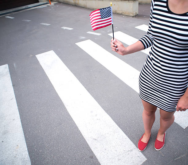 istock woman hand holding american flag 508375376