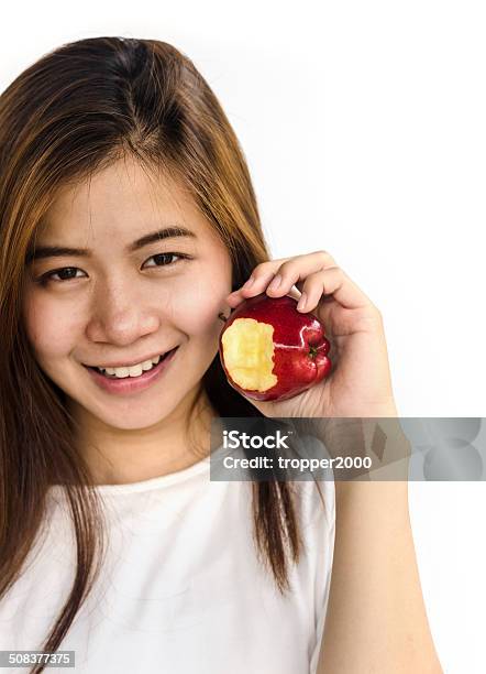 Young Woman Showing An Apple Stock Photo - Download Image Now - Adult, Adults Only, Apple - Fruit