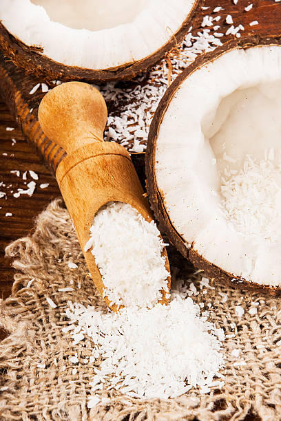 istock Coconut and coconut chips on a wooden background 508377568