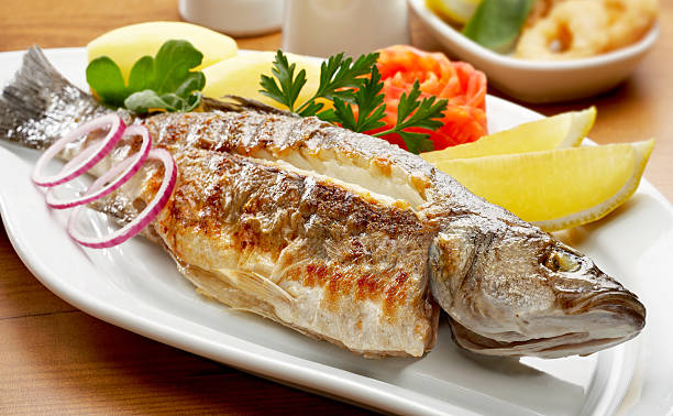 Grilled Sea Bass Grilled Sea Bass sea bass stock pictures, royalty-free photos & images