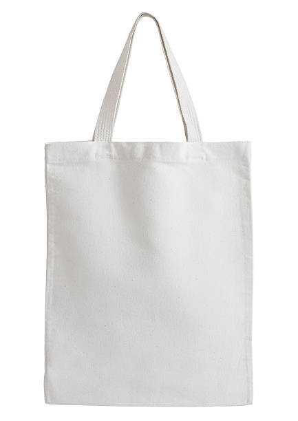 белый хлопок сумка на белом фоне изолированных - сумка стоковые фото и изображения