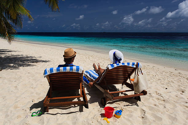 istock happy couple relax on a tropical beach 508379562