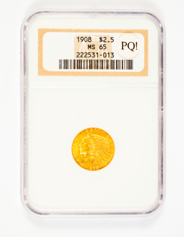 Springfield, OR, USA - April 2, 2014: MS65 gold 2.5 dollar Indian Head coin graded by NGC as premium quality.