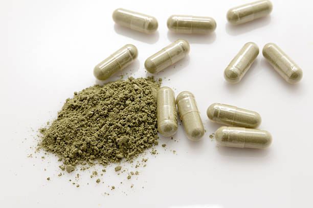istock Herbal medicine capsules on white background. 508382298
