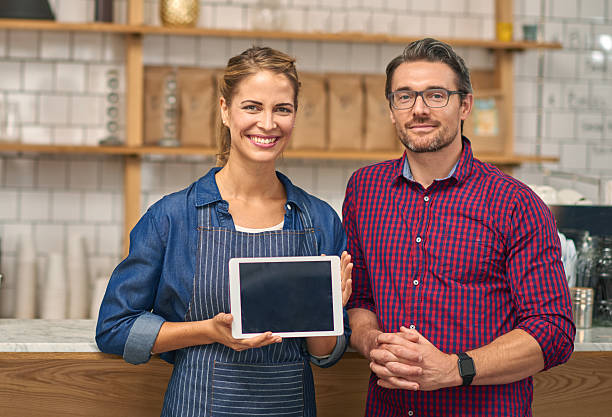 istock Baristas using digital tablet in coffee shop 508383166