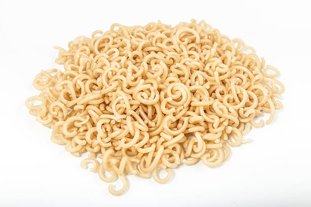 istock Mound of pasta on a white background close-up macro 508384200