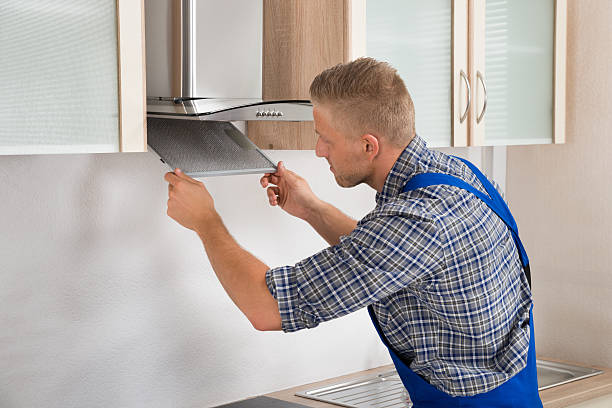 istock Repairman Repairing Kitchen Extractor Filter 508384840