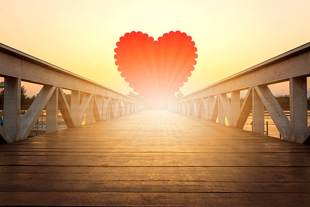 istock red heart on wooden bridge 508384948