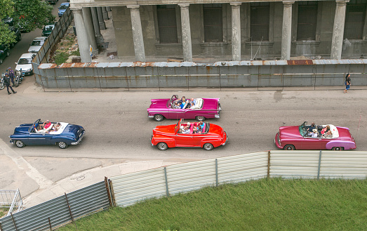 Havana, Сuba - January 18, 2016: People are driving old historical american cars at street of havana cuba