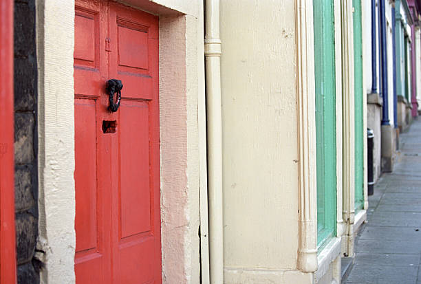 istock Multicoloured front doors on an English street 508388380