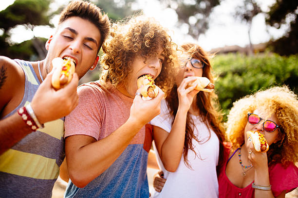 istock Friends Eating Hotdogs 508399791