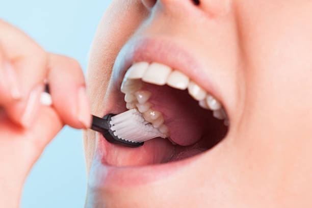 istock Girl cleaning teeth 508399825