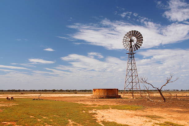 istock Windmill water pump in Australian outback 508400213