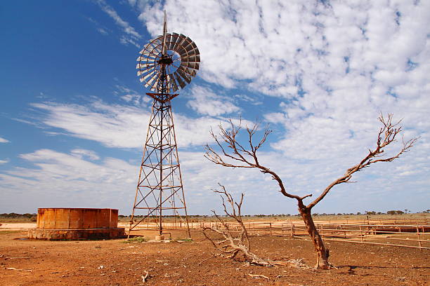 Windmill water pump in Australian outback Windmill water pump in Australian outback, Nullarbor Plain, Western Australia farmer-drought-australia stock pictures, royalty-free photos & images
