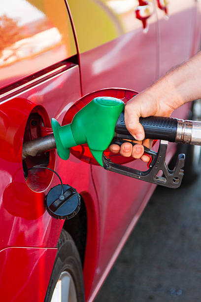 istock Person refueling a car at gas station 508402055
