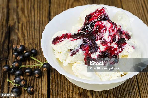 Ice Cream With Jam And Currant Stock Photo - Download Image Now - Bowl, Ice Cream, Large