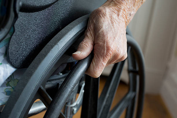 istock Hand and wheelchair 508405311