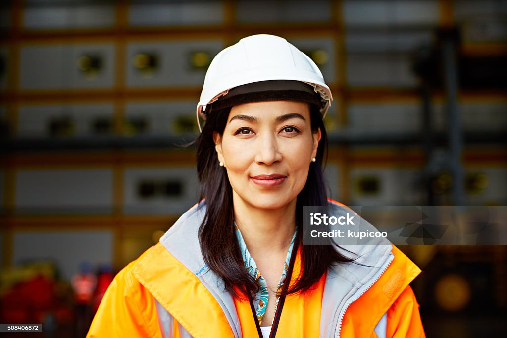 What happens on this dock is my responsibility Portrait of a woman in workwear standing on a commercial dock Engineer Stock Photo