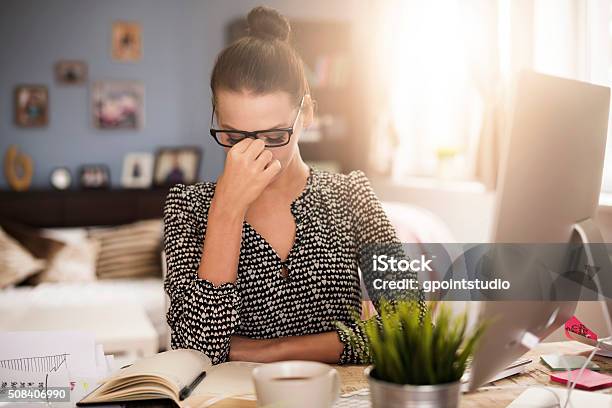 Strong Headache During Work At The Office Stock Photo - Download Image Now - Head In Hands, Women, Only Women