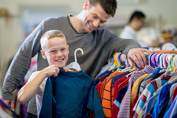 istock Little Boy Buying a Shirt 508407158