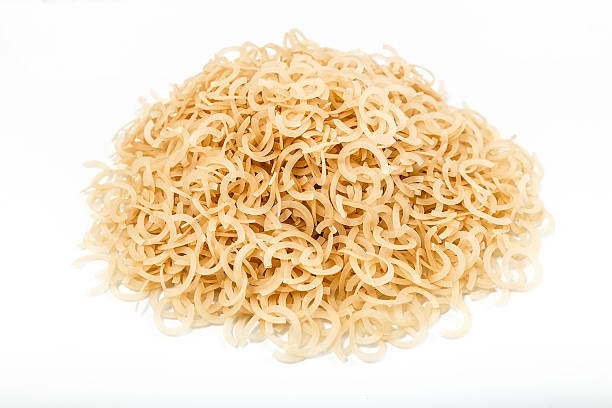 istock Mound of pasta on a white background close-up macro 508407304