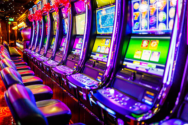 Slot machines in casino Line of electronic slot machines in casino. Property released. casino stock pictures, royalty-free photos & images