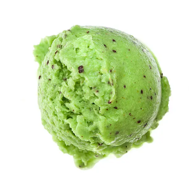 Photo of scoop of kiwi ice cream from top view white background