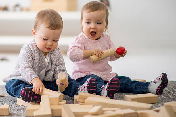 istock Toddlers Playing with Wooden Blocks 508407716