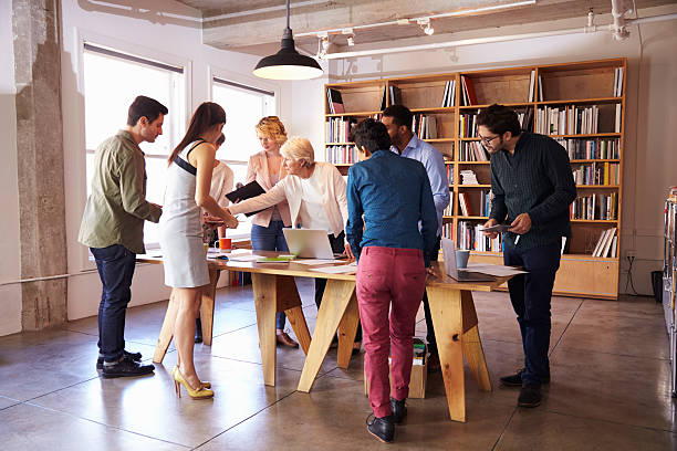 Business Team Meeting Around Table For Brainstorming Session